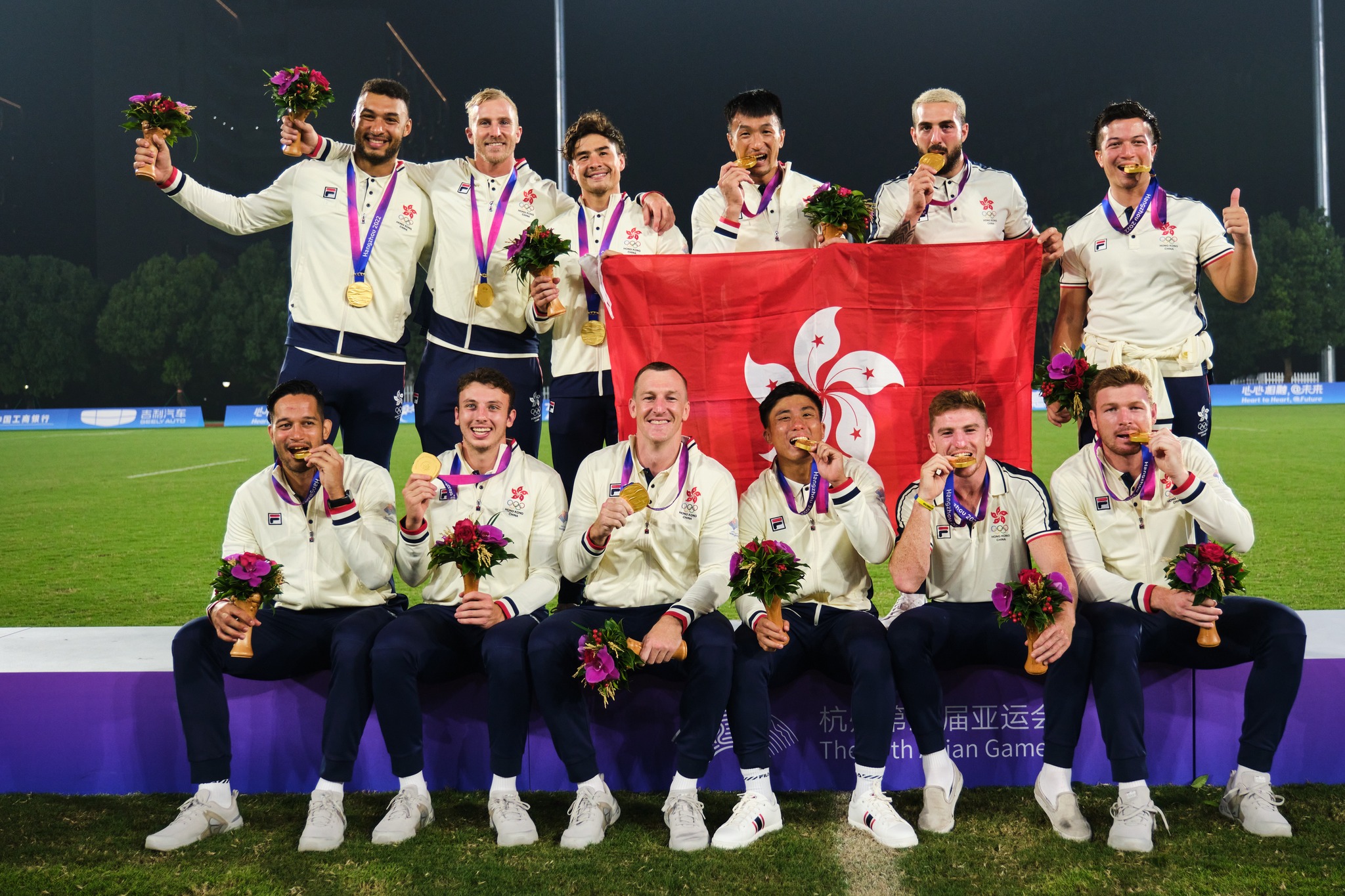 Hong Kong rugby sevens team celebrates their gold medal, after beating South Korea 14-7 in the final to retain their title.