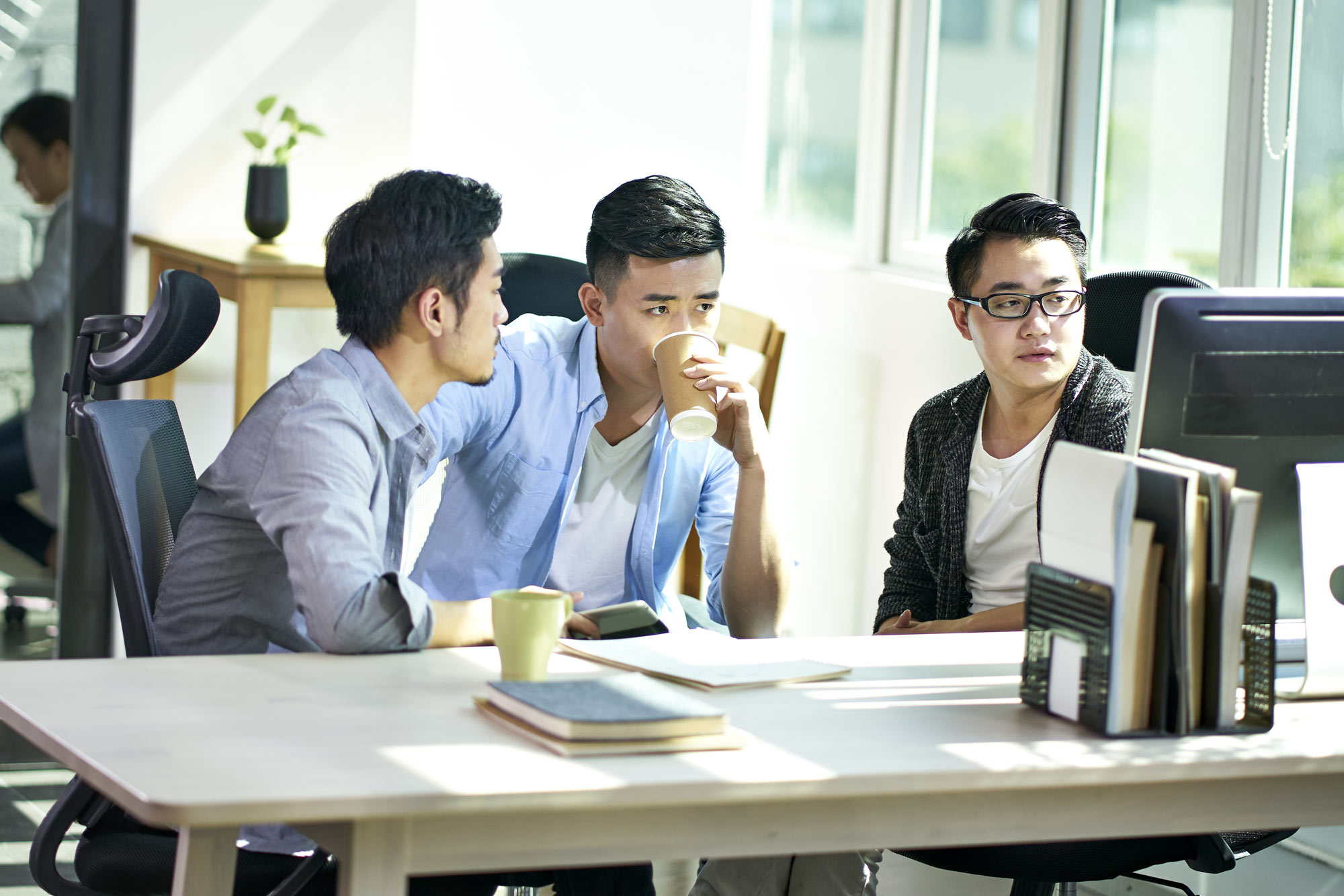 Asian business men working together in office